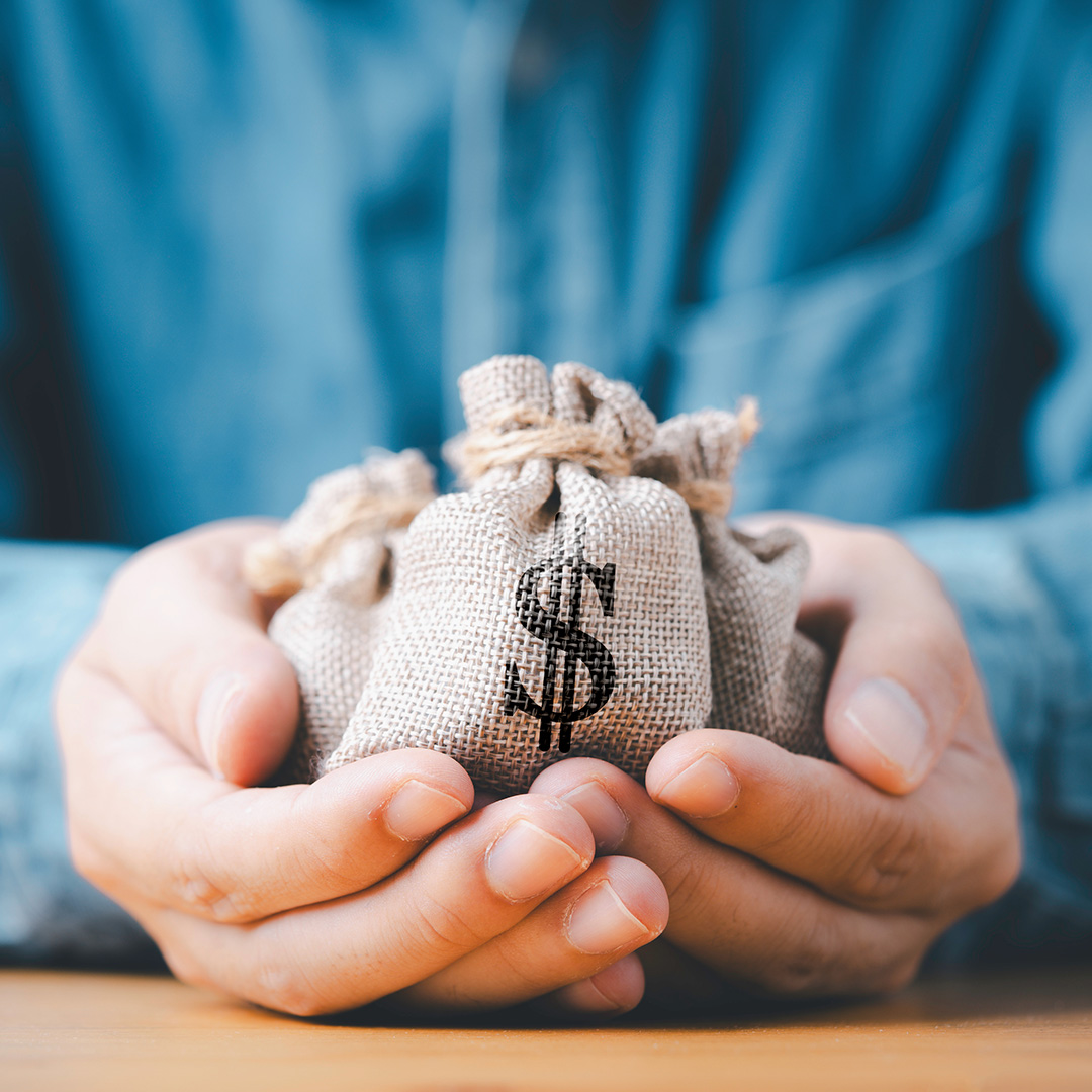Hands Holding Money Bag
